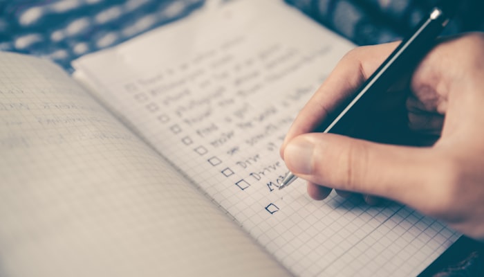A checklist and notebook used to plan the week